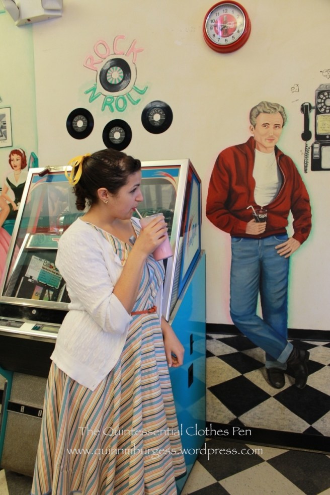 The actual owner of the pink shake also posed by the juke box. That guy on the wall is pretty funny.